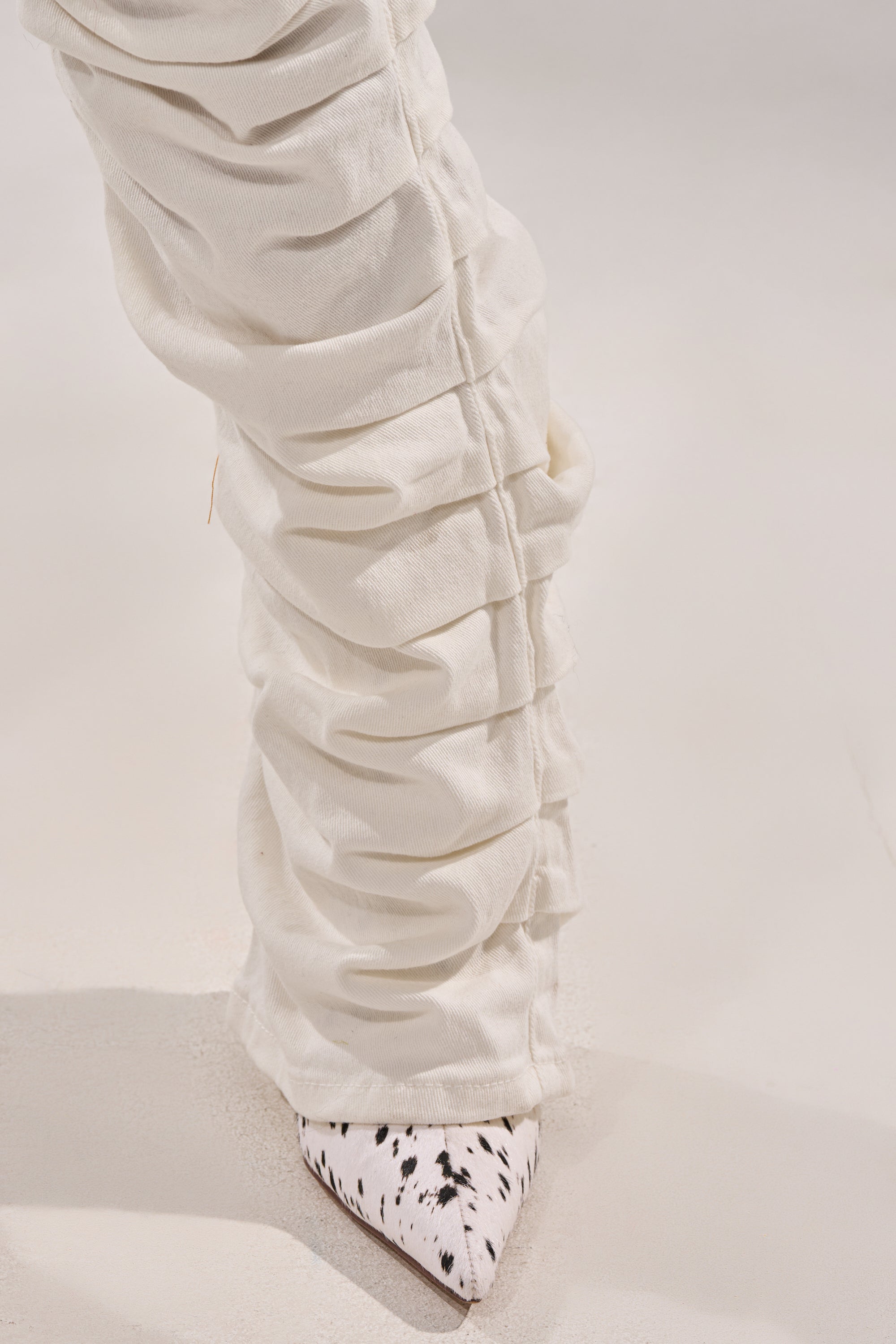 IT GETS EASIER STACKED CARGO PANT IN WHITE