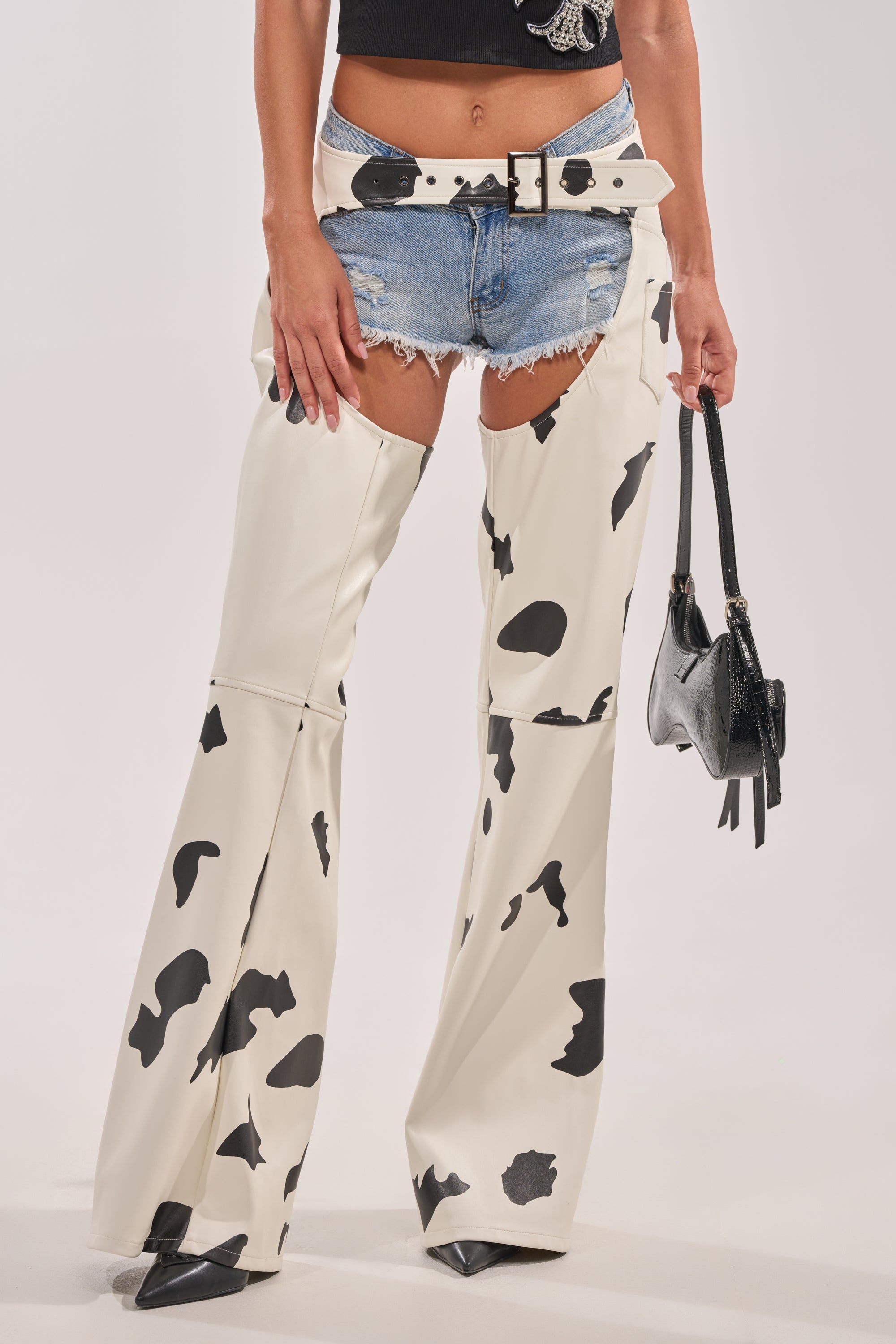 MOO OVER COW PRINT FAUX LEATHER CHAPS