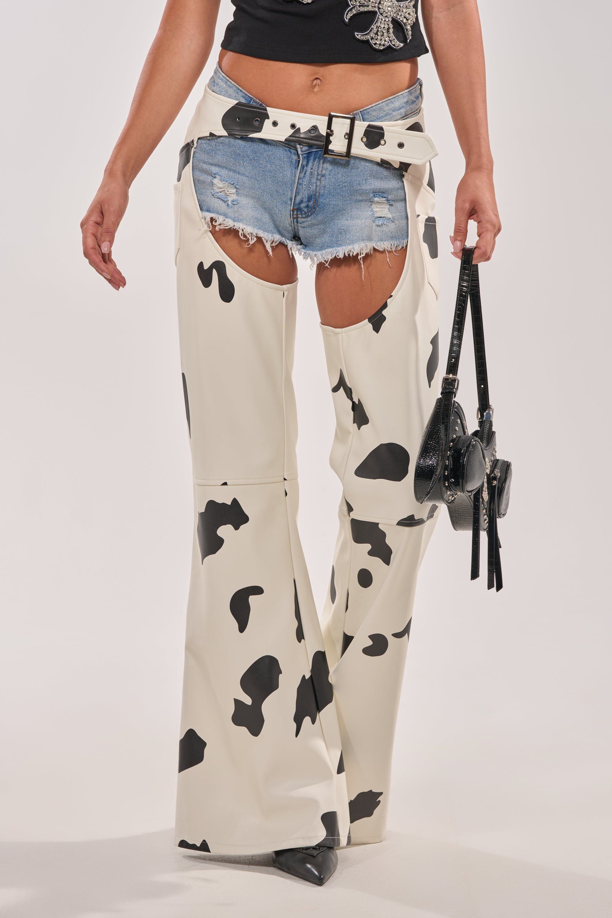 MOO OVER COW PRINT FAUX LEATHER CHAPS
