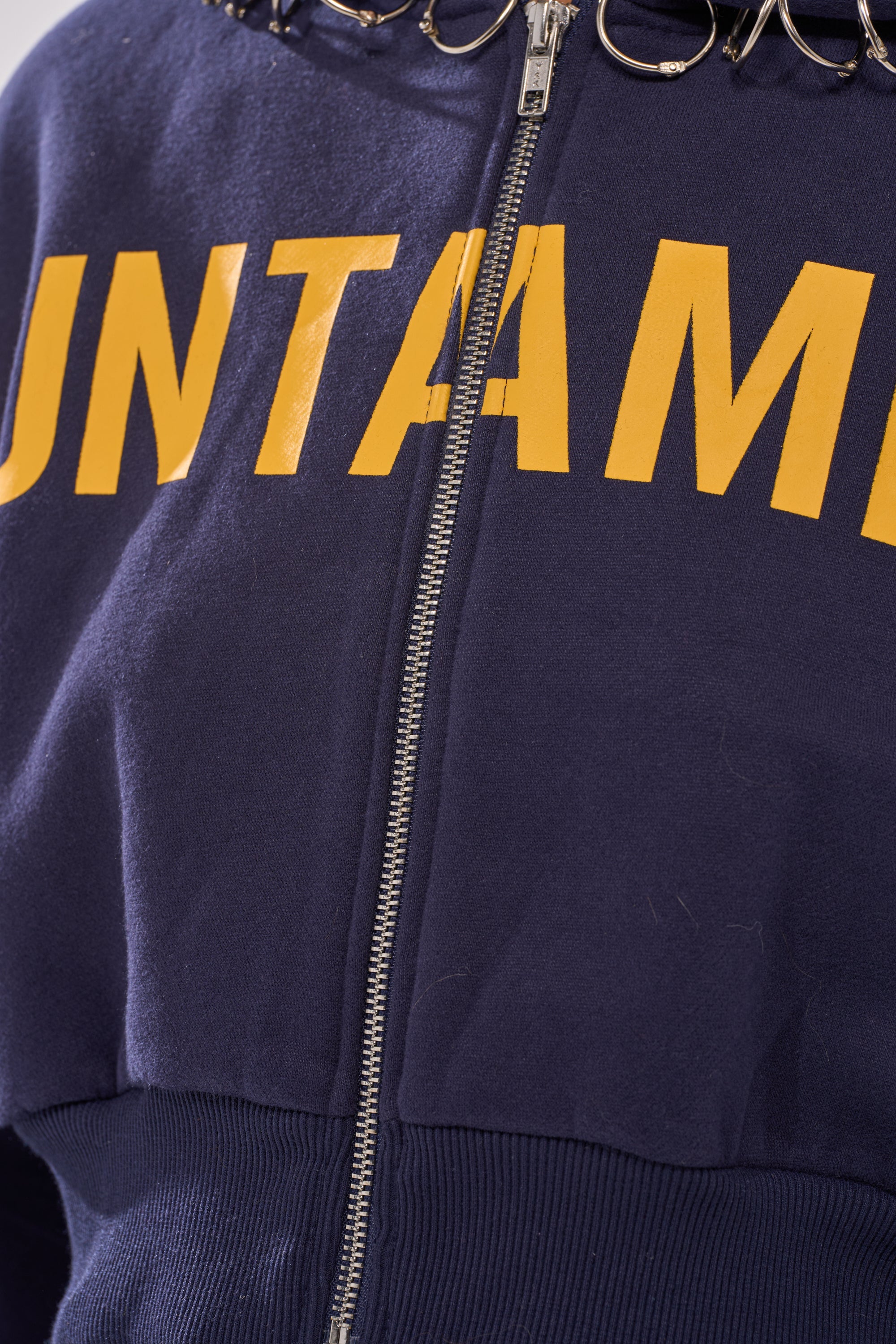 UNTAMED METAL RING SWEATSHIRT
