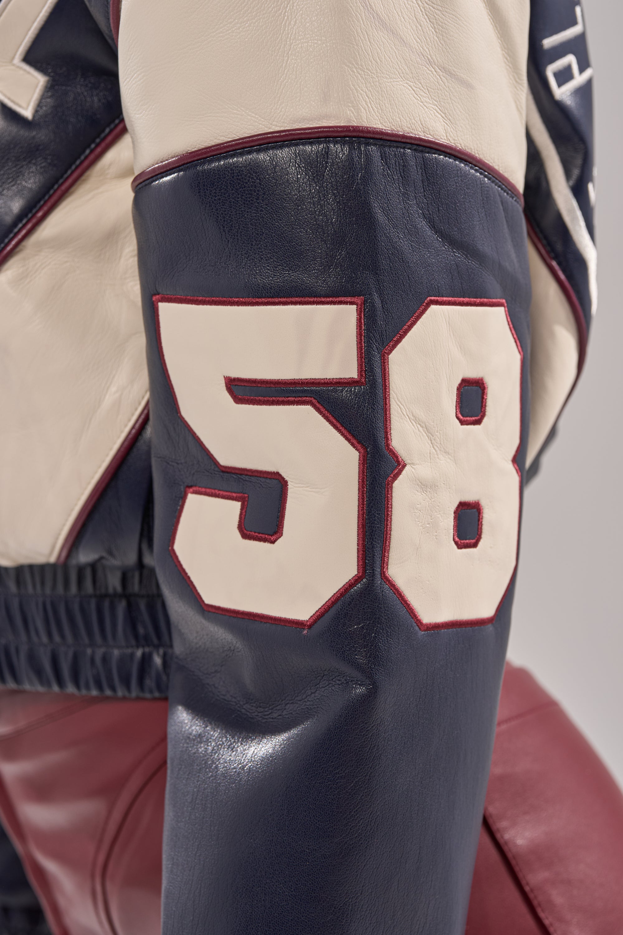 BUTTER LUXE VARSITY BOMBER